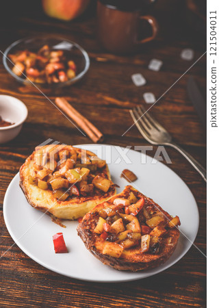 French toasts with apple and cinnamon French toasts with apple and cinnamon 121504011