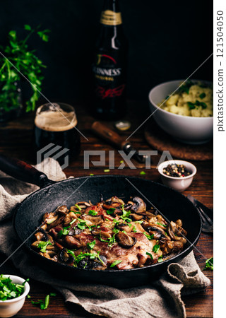 Fried pork neck steak with different mushrooms 121504050