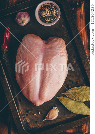 Raw chicken breast with spices Raw chicken breast with spices 121504289