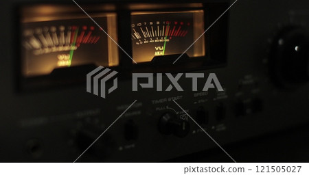 Analog VU meters on classic hi-fi reel-to-reel tape recorder. Retro sound level meter decibel meter in studio, vintage audio equipment. 121505027