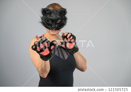Portrait of a woman in a cat costume on a white background. Quadrober. Portrait of a woman in a cat costume on a white background. Quadrober. 121505725