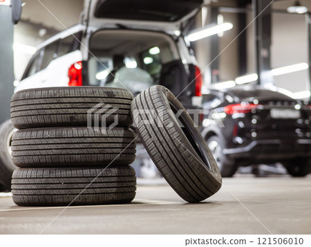 Changing tires for a car according to the season.  121506010