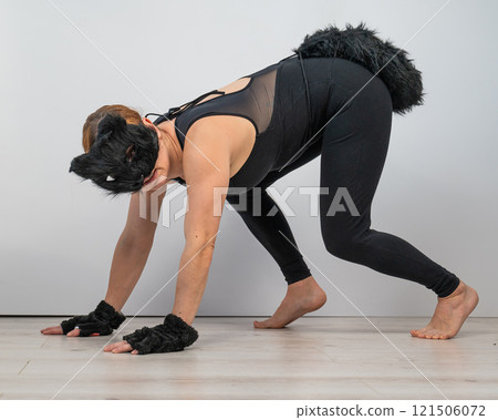 Caucasian woman in cat costume. Quadrober.  121506072