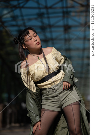 Young Asian woman posing at subway exit.  121506285