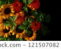 Colorful arrangement of sunflowers and dahlias with green leave on a 121507082
