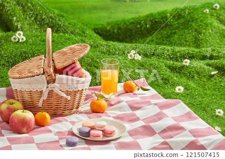 Template photo of spring picnic concept for advertisement design. Blank space on pink carpet for product displaying, decorated with some fruits and cakes Template photo of spring picnic concept for advertisement design. Blank space on pink carpet for product displaying, decorated with some fruits and cakes 121507415