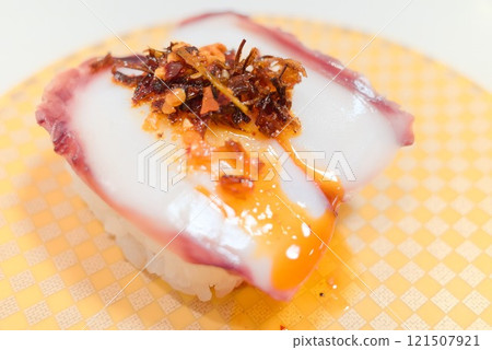A delicious dish at a conveyor belt sushi restaurant - Edible chili oil octopus 121507921