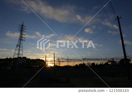 Scenery with sunrise and steel tower 121508183