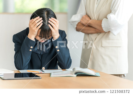 Junior high and high school girls suffering from stress due to studying and exams (shocked, depressed, panicked) Junior high and high school girls suffering from stress due to studying and exams (shocked, depressed, panicked) 121508372