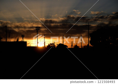 The sky of a rural residential area dyed in the sunset The sky of a rural residential area dyed in the sunset 121508493