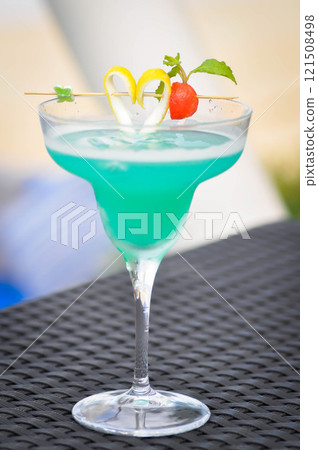 blue margarita or blue hawaii or cocktail 121508498