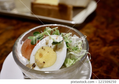 Mini salad: cabbage, radish sprouts, boiled egg, tomato 121509250