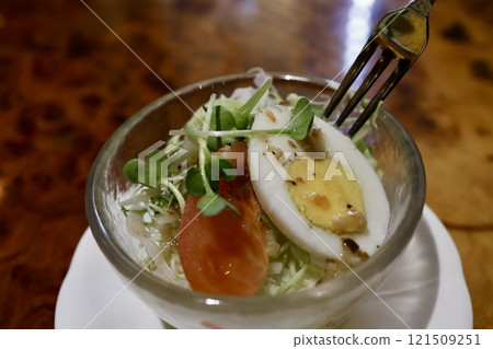 Mini salad: cabbage, radish sprouts, boiled egg, tomato 121509251
