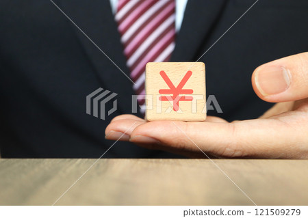 A man in a suit and the Japanese yen symbol 121509279