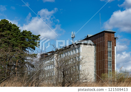 Antenna on the roof of the house with many radio transmitters. Antennas of communication in the city. 121509413
