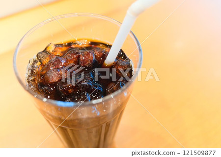 Taking a break and drinking iced coffee at a cafe in midsummer Taking a break and drinking iced coffee at a cafe in midsummer 121509877