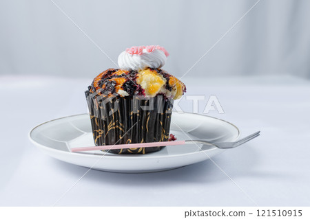 Berry and custard muffins with whipped cream 121510915