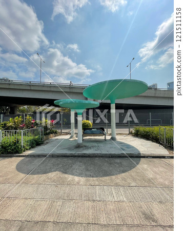 Hong Kong cityscape, retro cultural pavilion in park near road, bridge 121511158