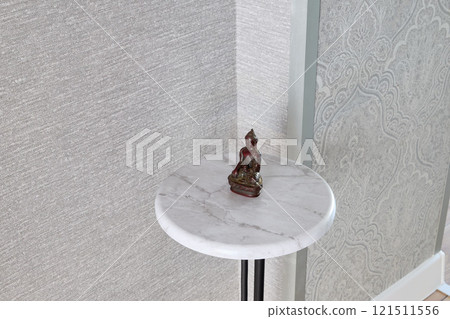 This stunning and elegant corner table features a beautifully crafted Buddha statue decor piece This stunning and elegant corner table features a beautifully crafted Buddha statue decor piece 121511556