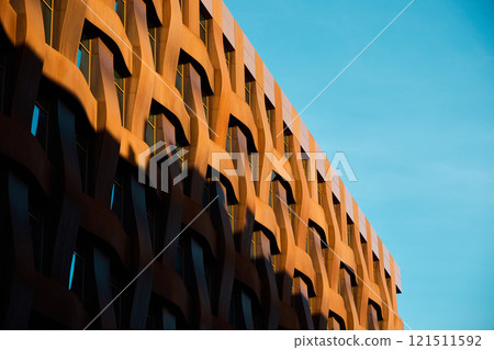 Modern architecture with a distinctive patterned facade enhances urban aesthetic appeal Modern architecture with a distinctive patterned facade enhances urban aesthetic appeal 121511592