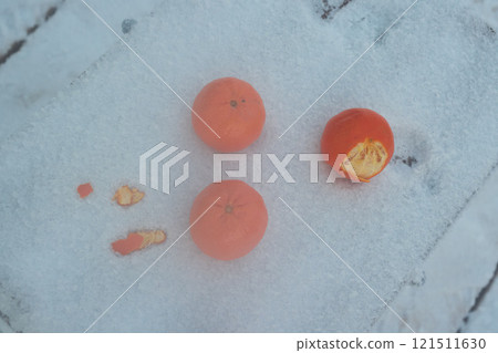 Bright oranges on a snowcovered surface create a stunning, eyecatching visual effect 121511630