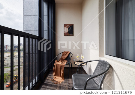 A Stylish and Modern Balcony Space with Cozy and Comfortable Seating for Relaxation 121511679