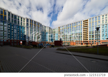 A Modern Urban Residential Complex featuring an eyecatching Blue Glass Facade that stands out A Modern Urban Residential Complex featuring an eyecatching Blue Glass Facade that stands out 121511719