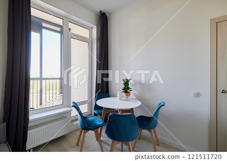 A Minimalist Dining Space Featuring Abundant Natural Light and Modern Stylish Elements A Minimalist Dining Space Featuring Abundant Natural Light and Modern Stylish Elements 121511720
