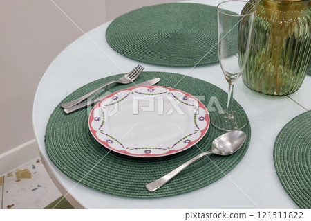 An Elegant and Stylish Dining Table Setting Featuring Beautiful Decorative Plate and Glassware An Elegant and Stylish Dining Table Setting Featuring Beautiful Decorative Plate and Glassware 121511822
