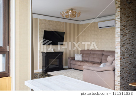 A Modern and Cozy Living Room Filled with a Stylish TV and Gorgeous Elegant Decor Elements A Modern and Cozy Living Room Filled with a Stylish TV and Gorgeous Elegant Decor Elements 121511828