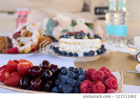 Enjoy a Delicious Summer Fruit Spread with an assortment of Desserts and Refreshments Enjoy a Delicious Summer Fruit Spread with an assortment of Desserts and Refreshments 121511862