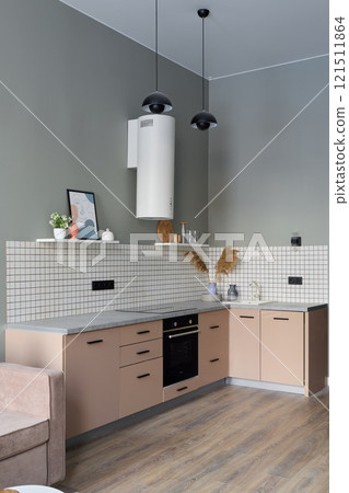 A Modern Minimalist Kitchen Featuring Stylish Decor Accentuated with Warm Color Tones A Modern Minimalist Kitchen Featuring Stylish Decor Accentuated with Warm Color Tones 121511864