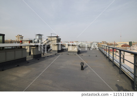 A breathtaking industrial rooftop view showcasing various types of equipment and structures A breathtaking industrial rooftop view showcasing various types of equipment and structures 121511932