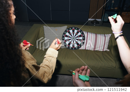 Friends Playing Darts At Home 121511942
