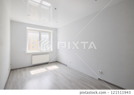 This is a bright and minimalist unfurnished room that features ample natural light pouring in This is a bright and minimalist unfurnished room that features ample natural light pouring in 121511943