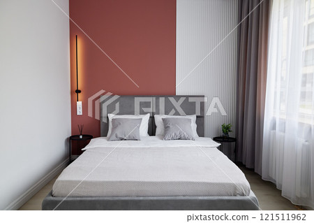 A Modern Bedroom Interior Featuring a Cozy and Inviting Design for Ultimate Comfort and Relaxation 121511962