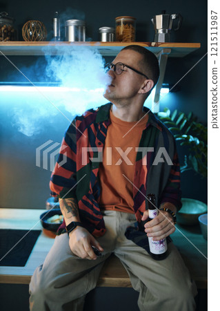 Guy Smoking And Drinking At Party Guy Smoking And Drinking At Party 121511987