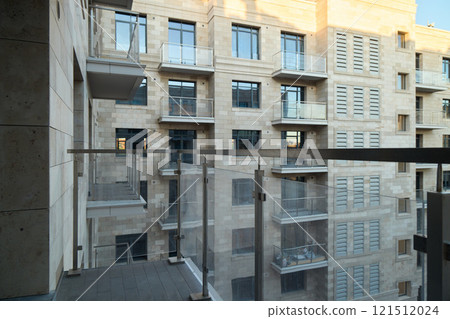 A Beautiful Modern Residential Apartment Building Featuring a Stunning Balcony View 121512024