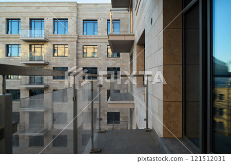 A Modern Balcony Overlooking a Stunning View of Urban Architecture and City Life 121512031