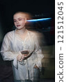 Woman Drinking Wine At Party 121512045