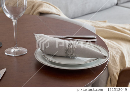 An Elegant Dining Setup Featuring Beautiful Napkin Arrangements and Exquisite Glassware An Elegant Dining Setup Featuring Beautiful Napkin Arrangements and Exquisite Glassware 121512049