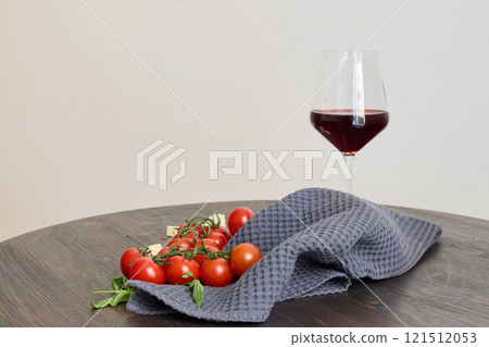 Savoring Fresh Tomatoes and Fine Red Wine Beautifully Presented on a Rustic Wooden Table Savoring Fresh Tomatoes and Fine Red Wine Beautifully Presented on a Rustic Wooden Table 121512053