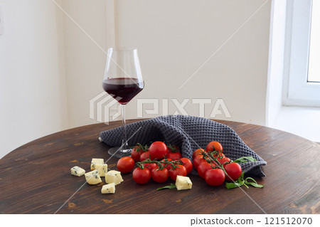 Indulge in Delicious Wine and Cheese Pairing with Fresh, Juicy Tomatoes for a Delightful Experience 121512070