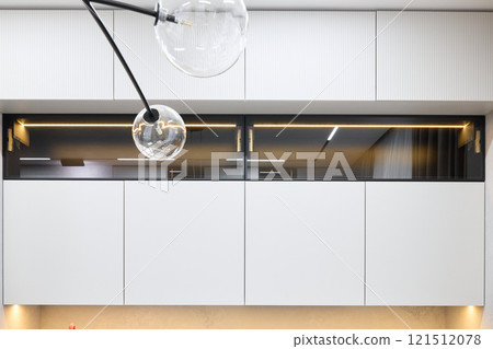 Discover modern interior design with a stylish light fixture that uniquely enhances any space 121512078