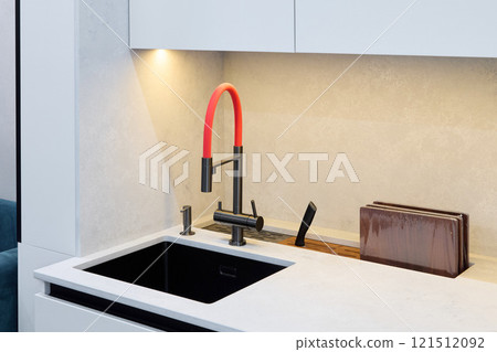 Discover a Modern Kitchen Sink featuring a Stylish and EyeCatching Red Faucet Design 121512092