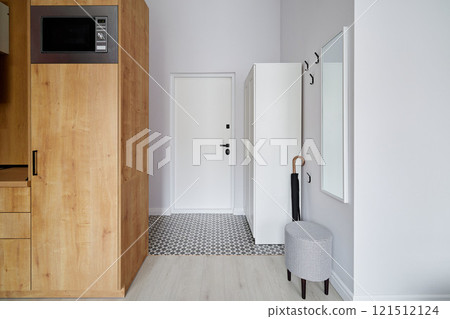 A Modern Entryway with Minimalist Design bathed in Natural Light, creating an inviting feel A Modern Entryway with Minimalist Design bathed in Natural Light, creating an inviting feel 121512124