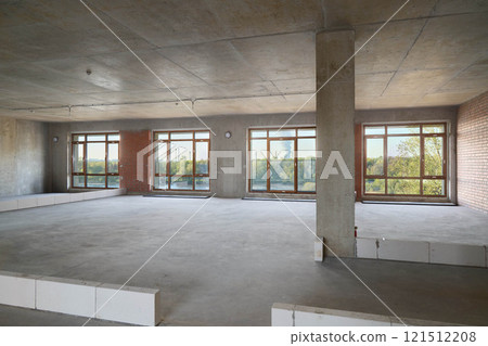 This spacious unfinished interior boasts large windows that allow for abundant natural light 121512208
