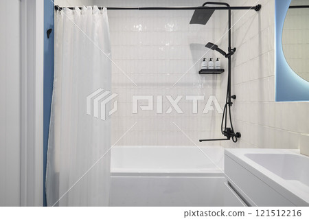 A modern bathroom with a sleek bath and shower combo for ultimate convenience and comfort 121512216