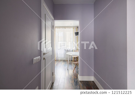 This hallway has light purple walls beautifully complemented by stylish flooring choices This hallway has light purple walls beautifully complemented by stylish flooring choices 121512225
