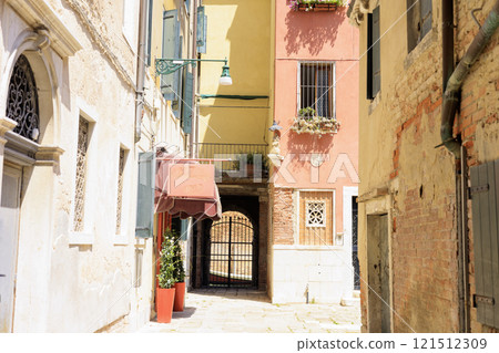 Narrow streets and pretty buildings in Venice, Italy 121512309